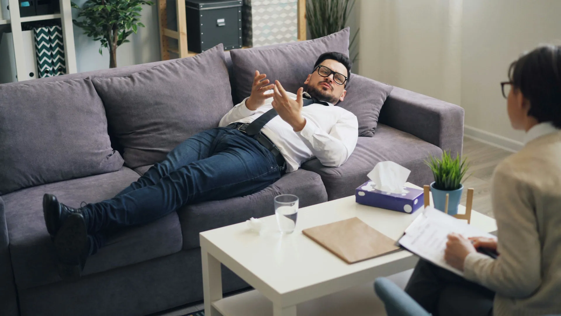 A man is explaining his thoughts and feeling during a session of Cognitive Behavioural Therapy.