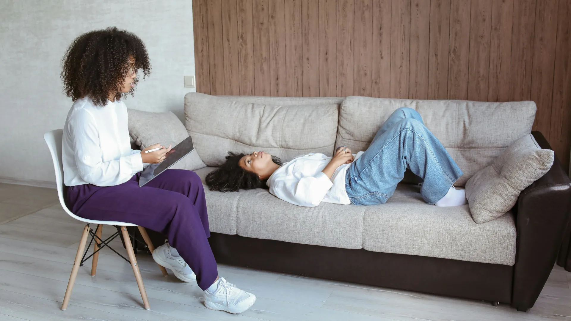 A young lady discussing with her counsellor about life situations.